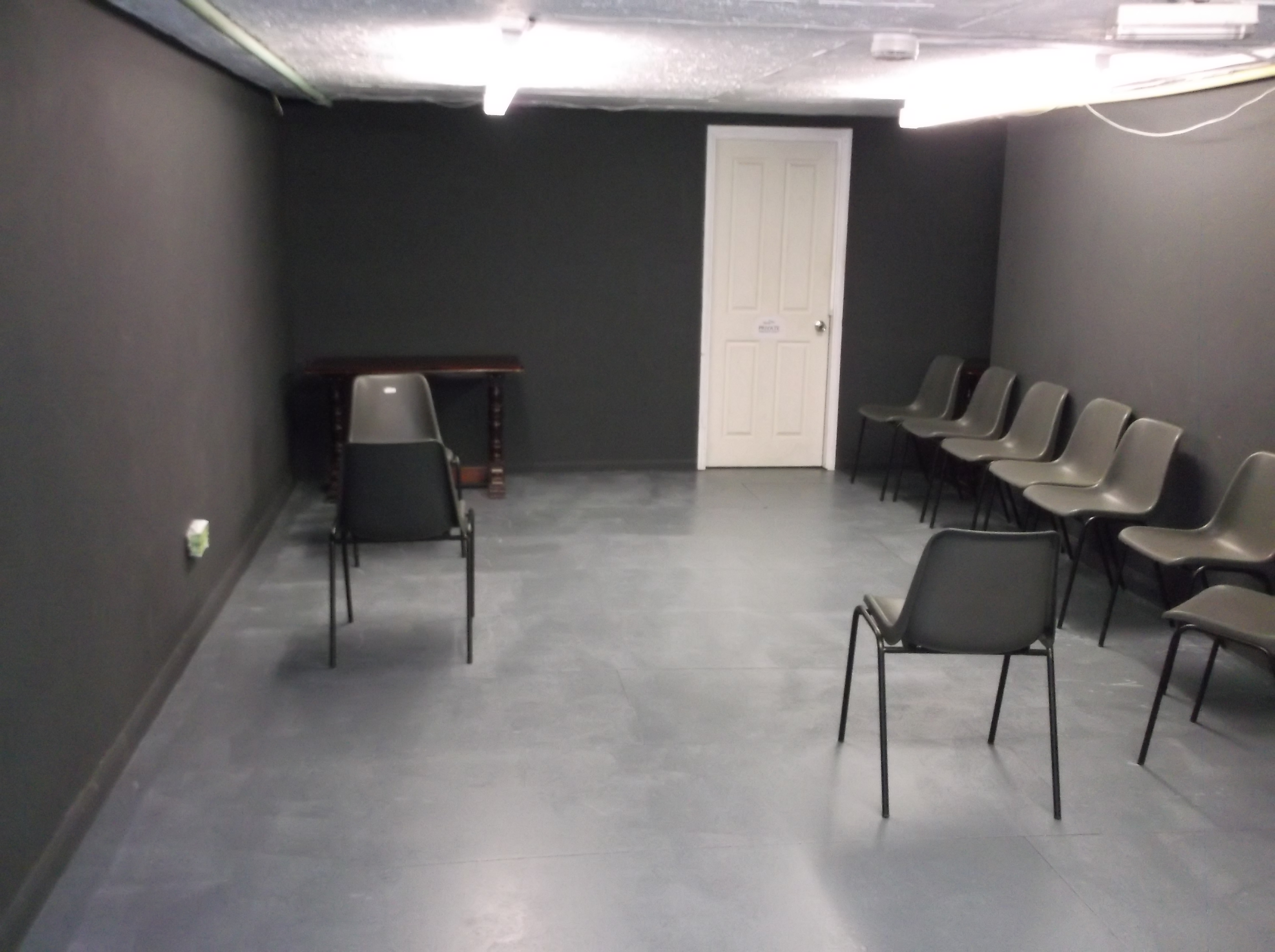 Minimalist meeting space in The Calder Theatre Bookshop for workshops and discussions.