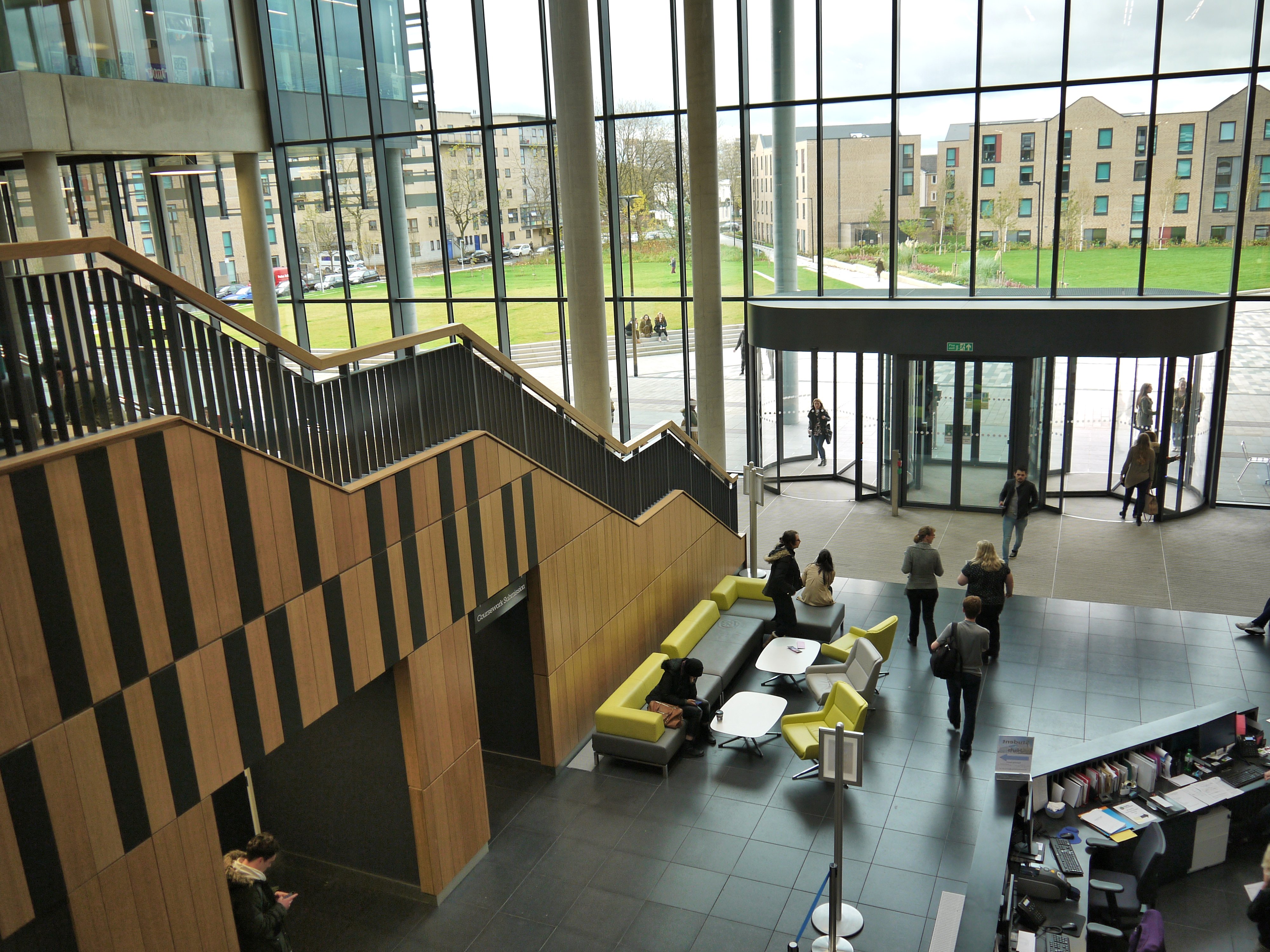 Modern lobby with large glass windows in Brooks Building, ideal for events and networking.