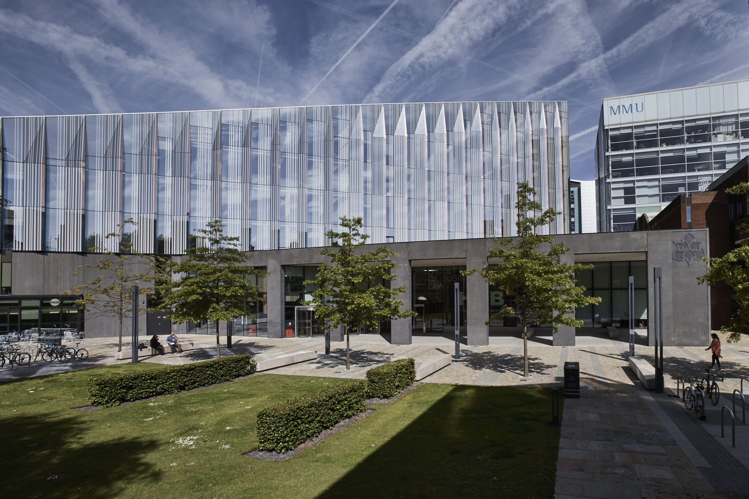 Modern business school meeting space with glass facade, ideal for conferences and events.