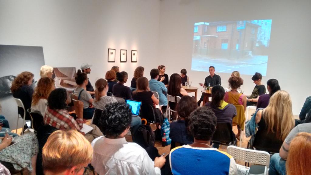 Panel discussion at Nunnery Gallery with engaged audience and dynamic speakers.