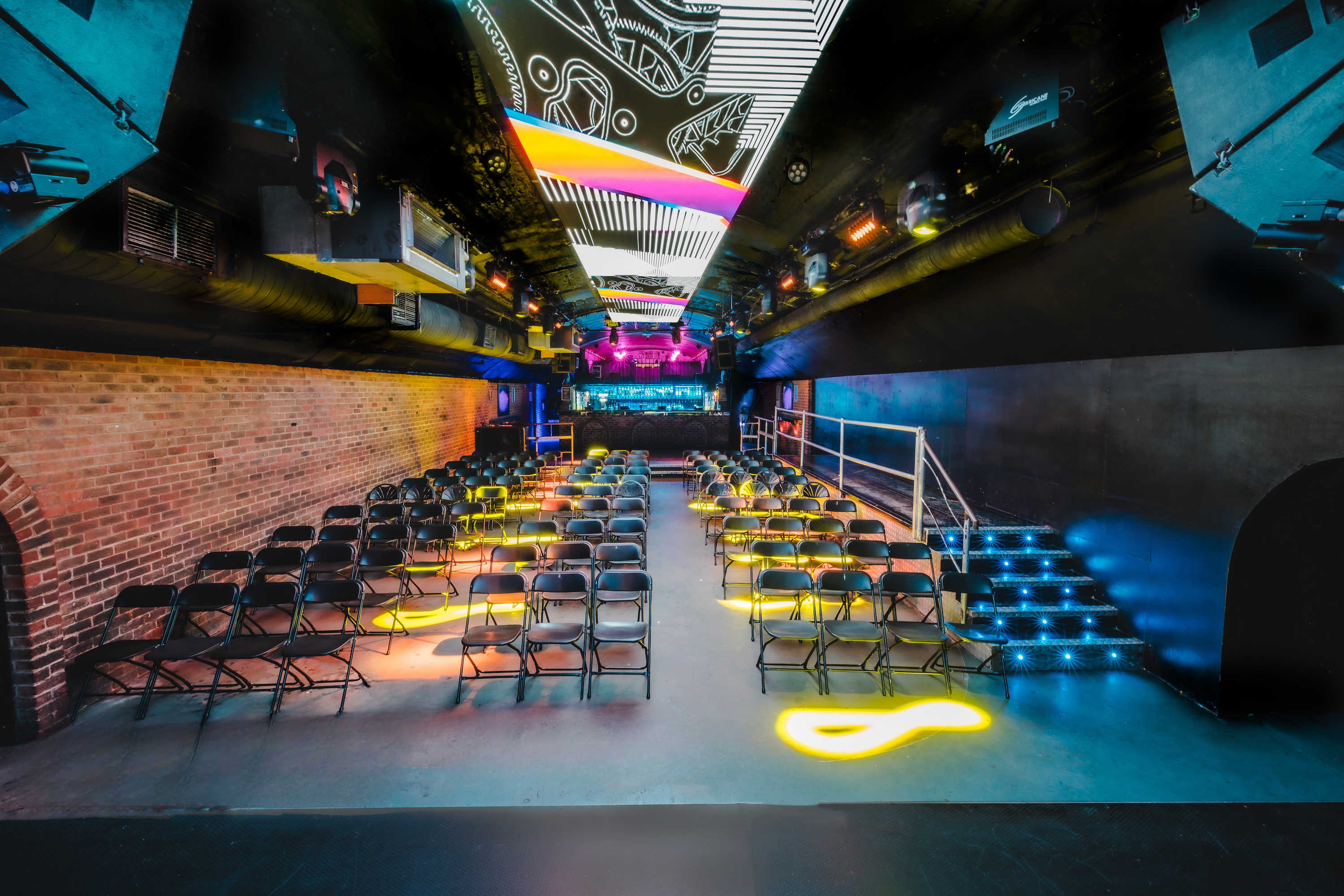 Fire in Vauxhall Arches: versatile event space with vibrant lighting for dynamic gatherings.