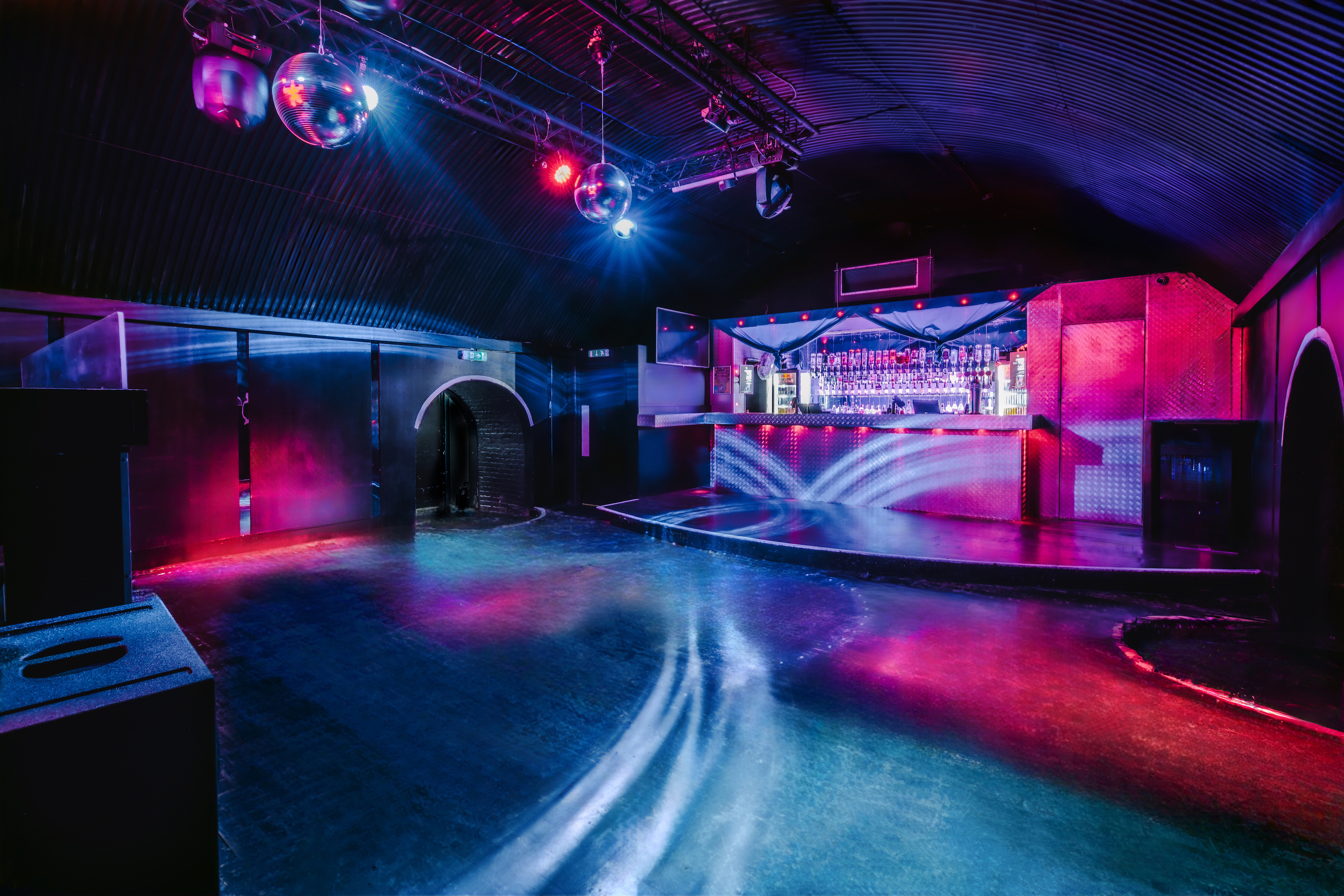 Vibrant Vauxhall Arches event space with colorful lighting for nightlife gatherings.