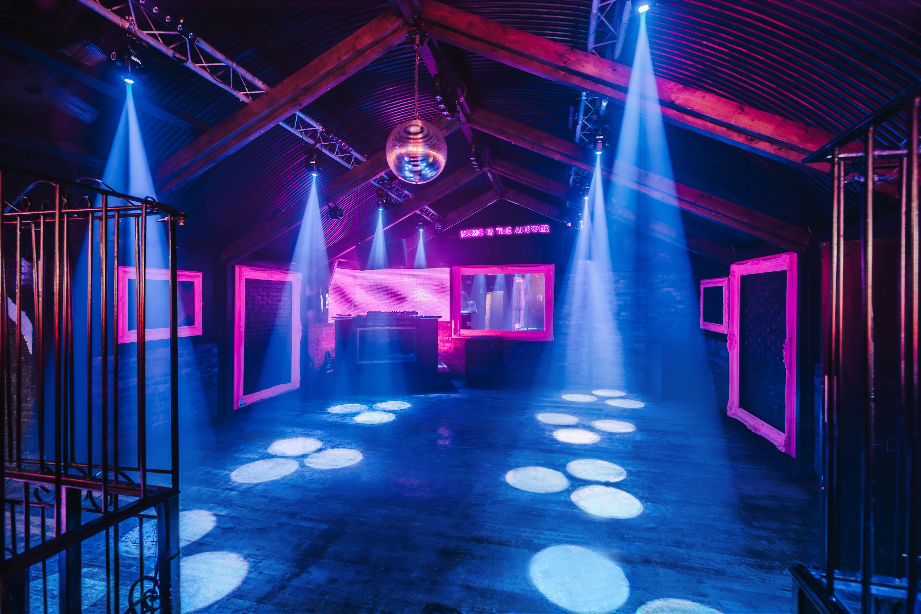 Vibrant Vauxhall Arches event space with disco ball for parties and corporate gatherings.