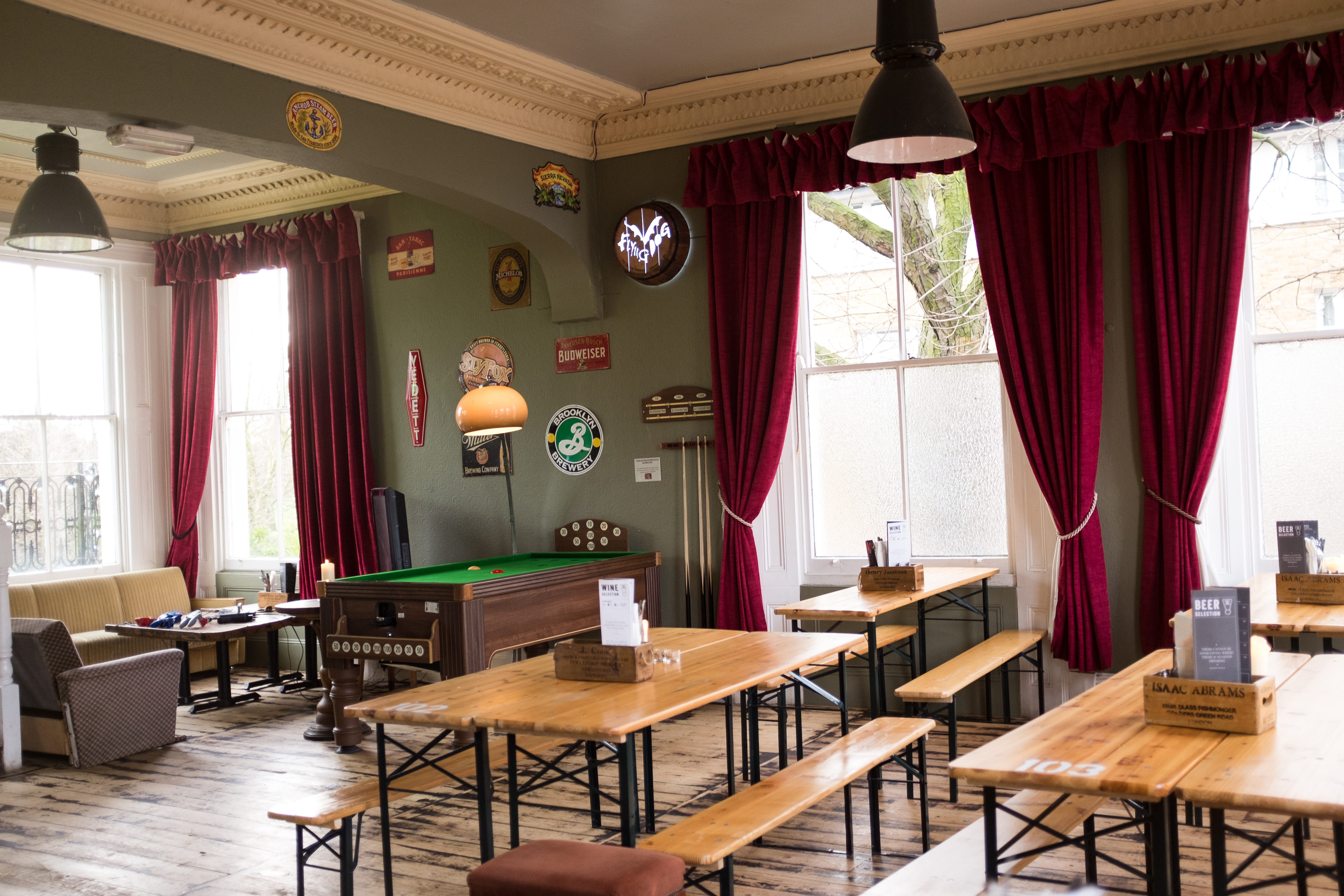 Cozy function room with rustic decor, ideal for casual events and team-building activities.