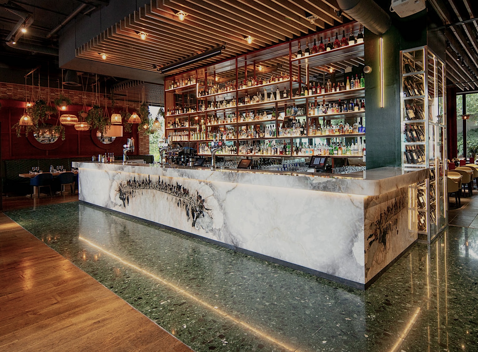 Semi-private bar area with marble countertop, ideal for cocktail receptions and networking events.