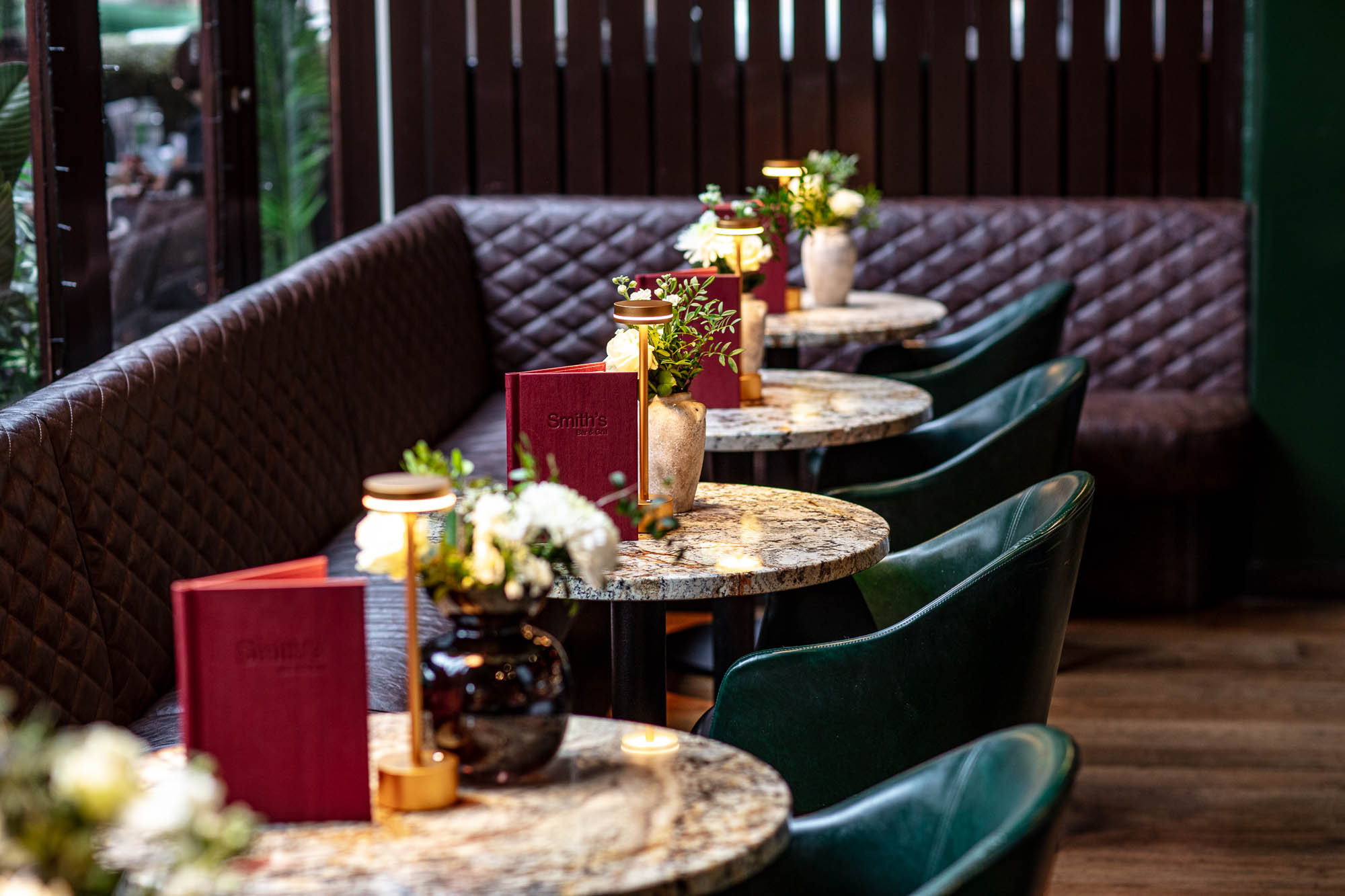 Semi-private bar area with plush seating for intimate gatherings and corporate events.