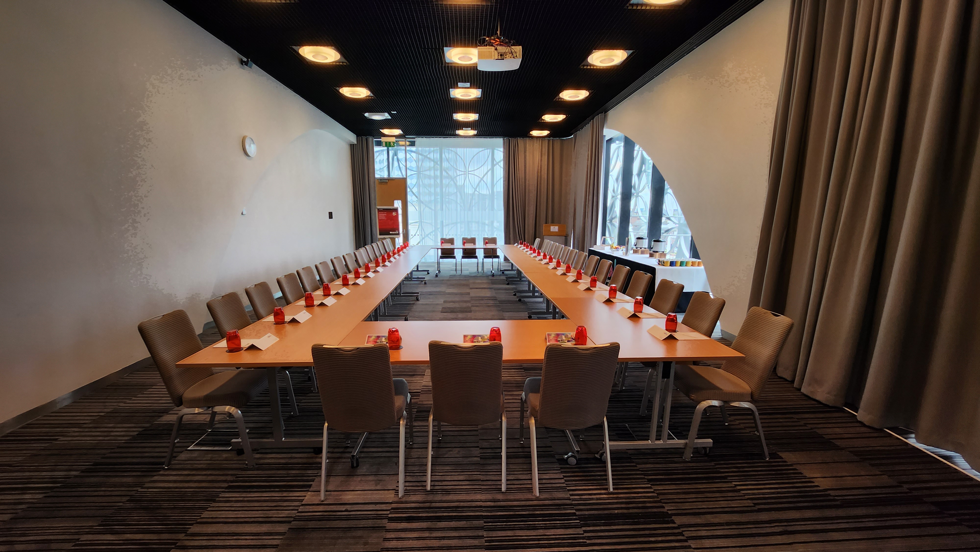 U-shaped meeting room in Unique Venues Birmingham, ideal for collaborative discussions.