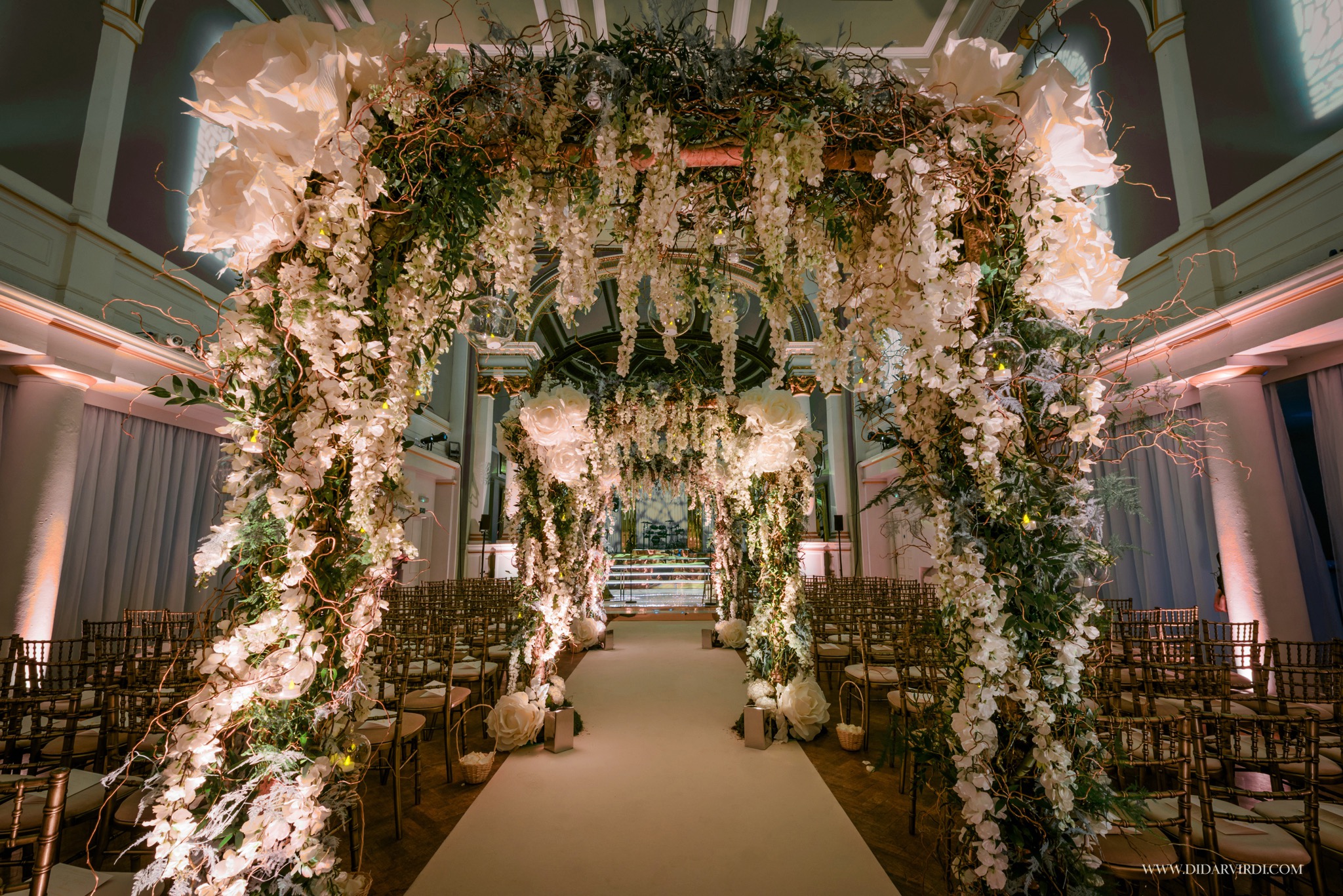 Soane Hall wedding venue with floral aisle and elegant seating arrangement.