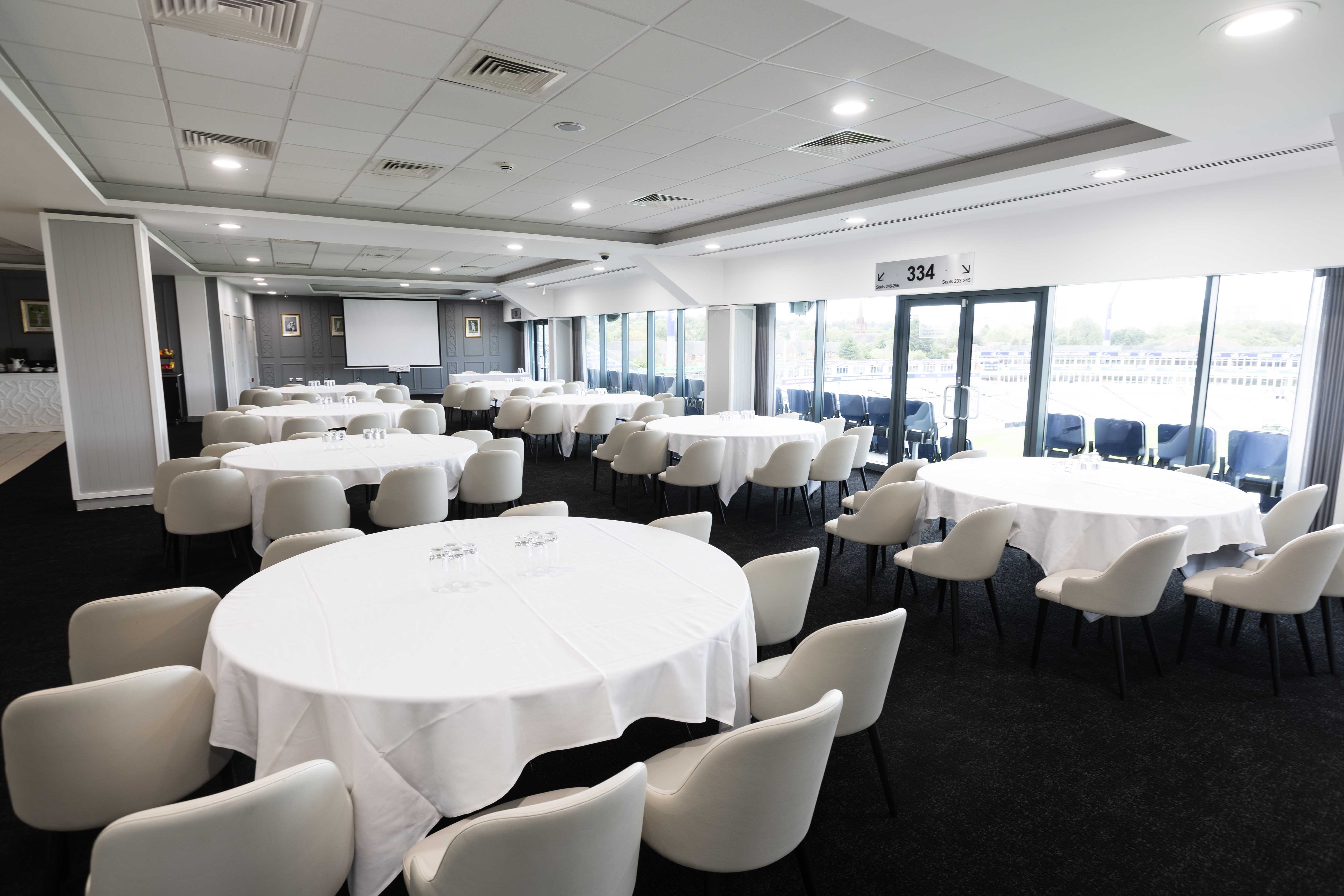Warwickshire Suite at Edgbaston Stadium with floor-to-ceiling windows for corporate events.