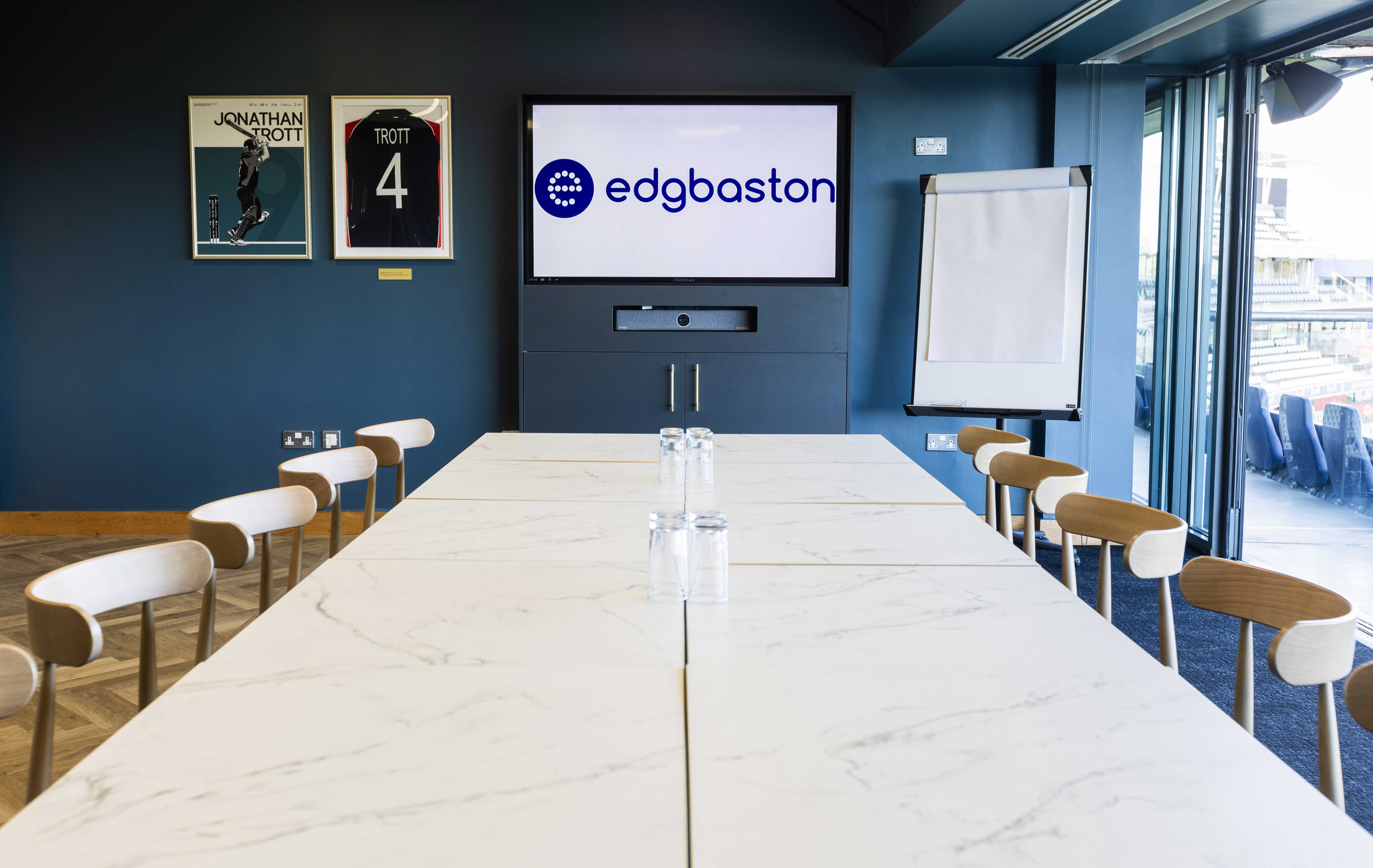 Executive boardroom at Edgbaston Stadium with pitch views for corporate events and meetings.