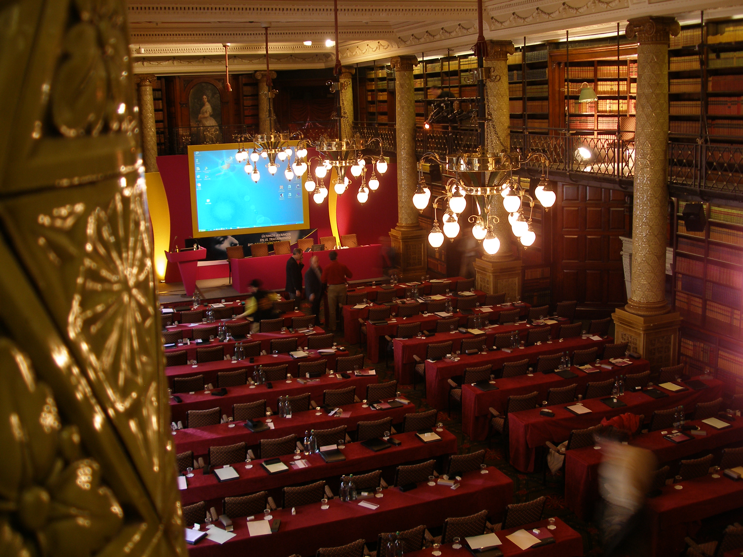 Gladstone Library conference setup with red tablecloths, ideal for events and presentations.