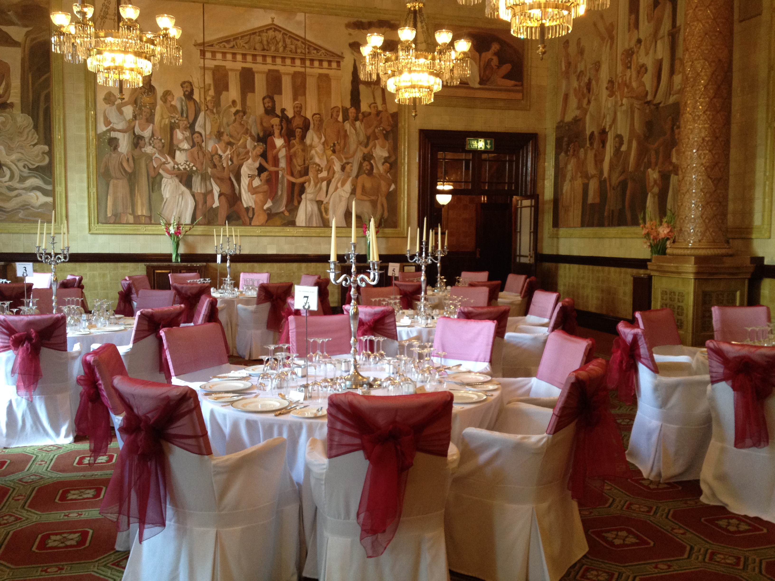 Elegant banquet room with round tables, ideal for weddings and corporate events.