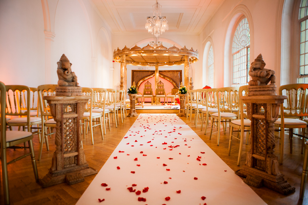 Elegant wedding ceremony space at One Marylebone with rose petal aisle and soft lighting.