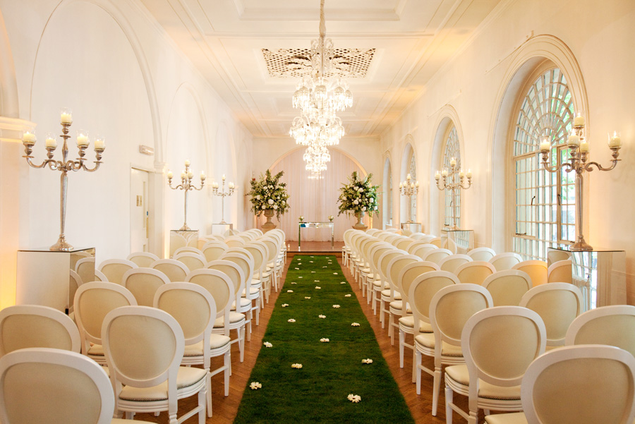 Elegant wedding venue with white decor and lush greenery at One Marylebone.