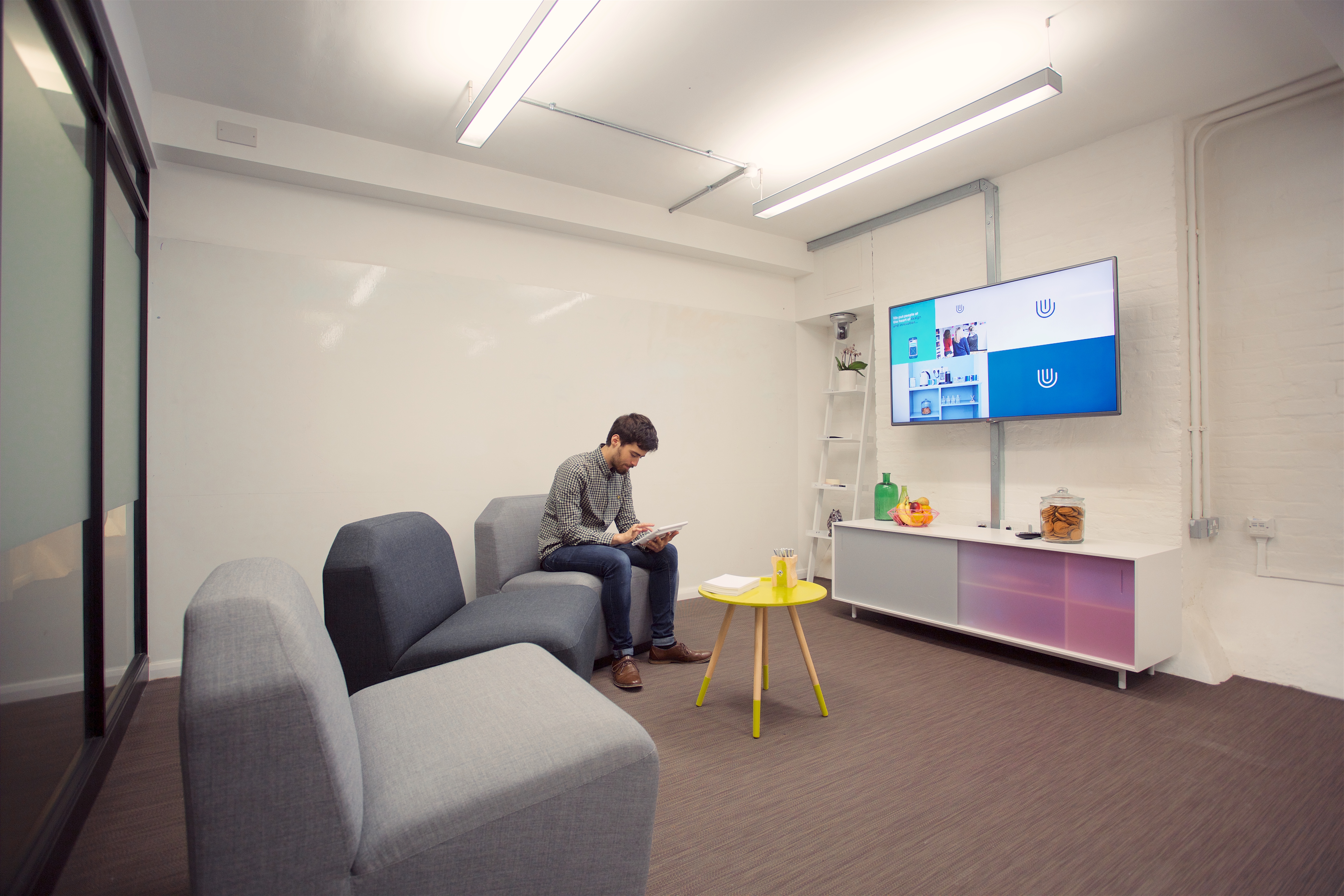 Modern meeting space in Sutherland Labs with sleek furniture for collaborative sessions.