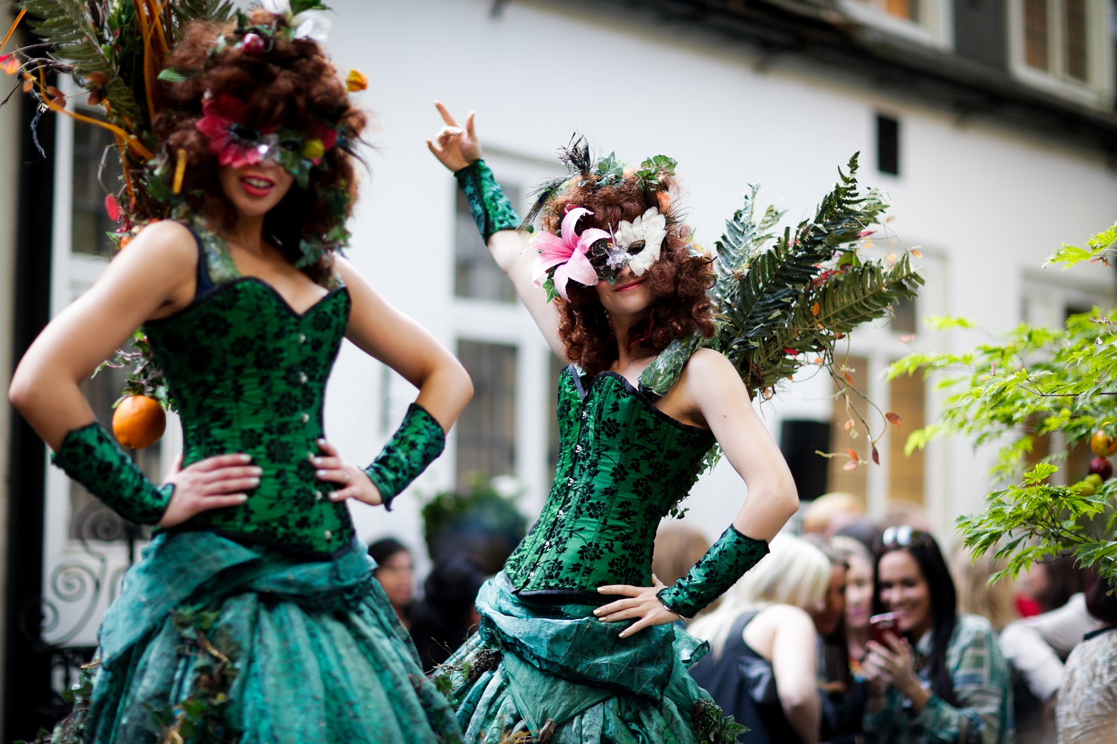 Performers in vibrant costumes at The City Garden, ideal for themed outdoor events.