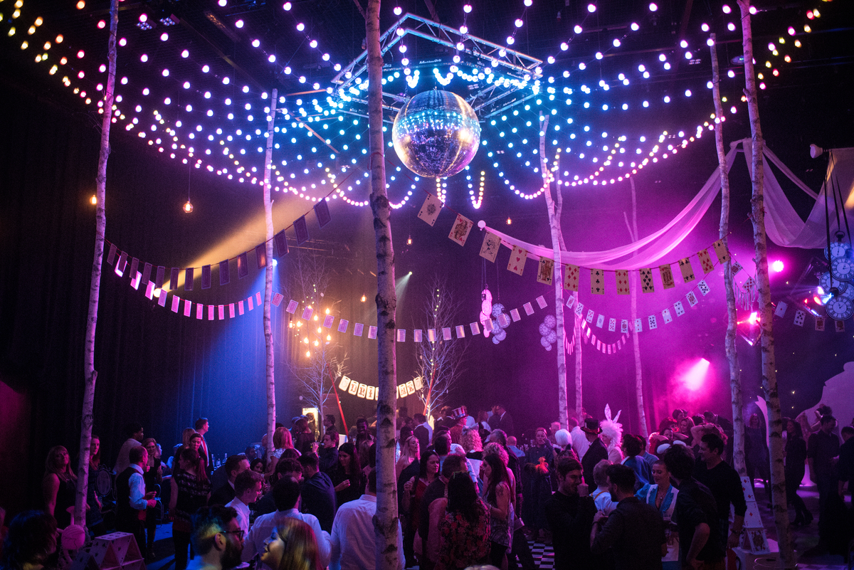 Vibrant event space at The Studio Theatre with colorful lights for networking and celebration.