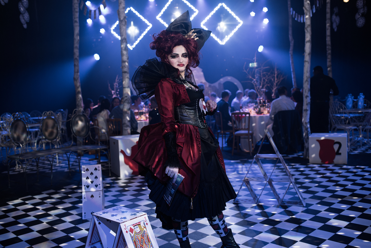 The Studio Theatre event with vibrant lighting and performer in elaborate costume.