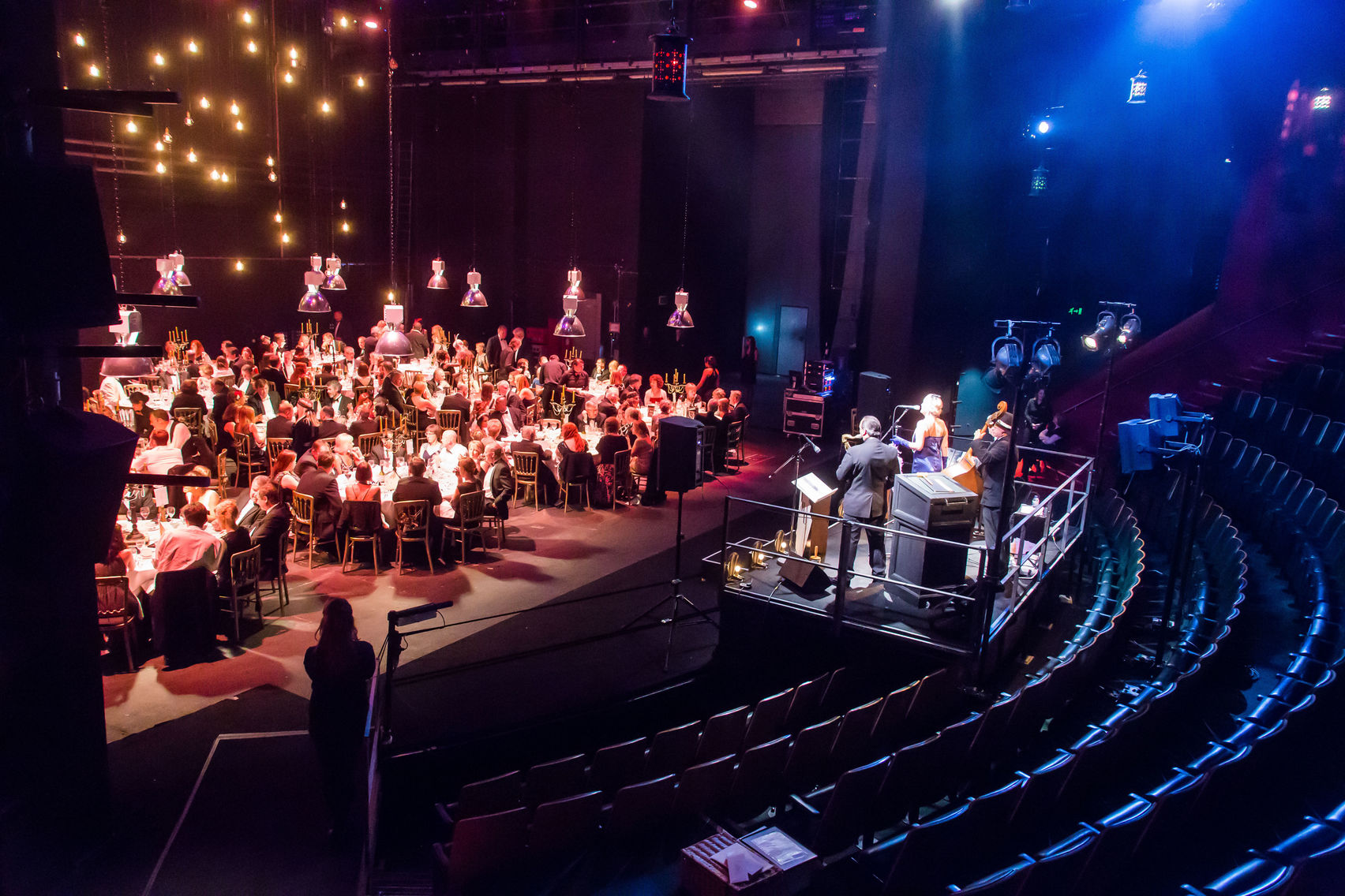 Gala event at The House in Unique Venues Birmingham with elegant table seating and stage.