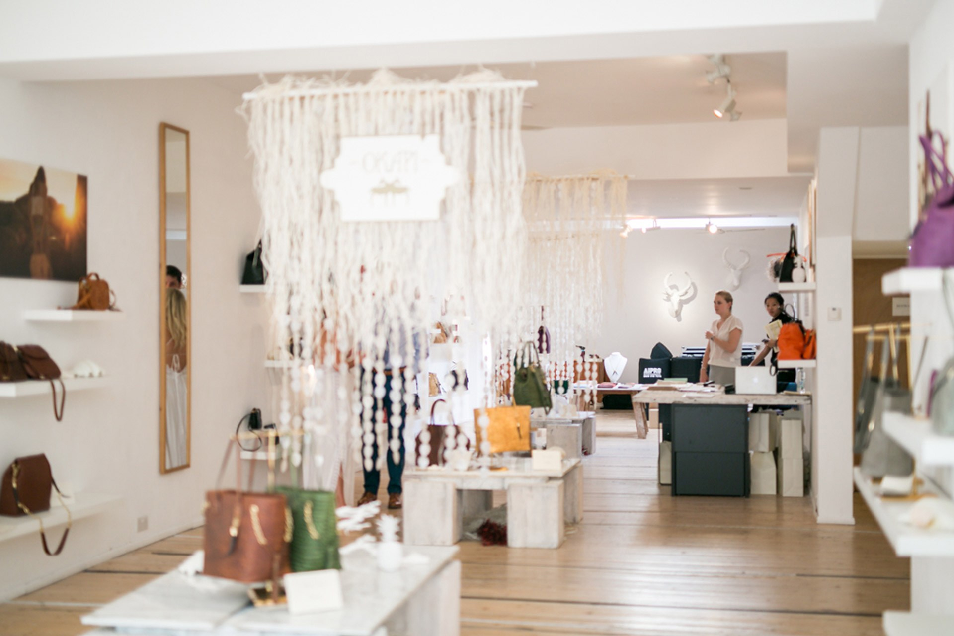 Stylish boutique venue with handbags, perfect for intimate events and product launches.