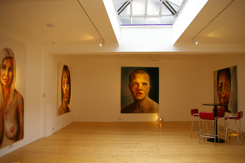 Contemporary art gallery with striking portraits, ideal for exhibitions and events.