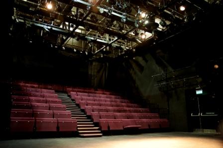 Versatile theater space in Birmingham with tiered seating for presentations and performances.