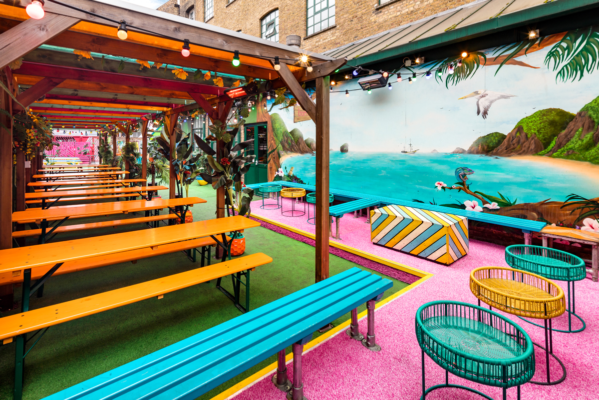 Vibrant outdoor event space La Terraza in Shoreditch with colorful seating for summer parties.
