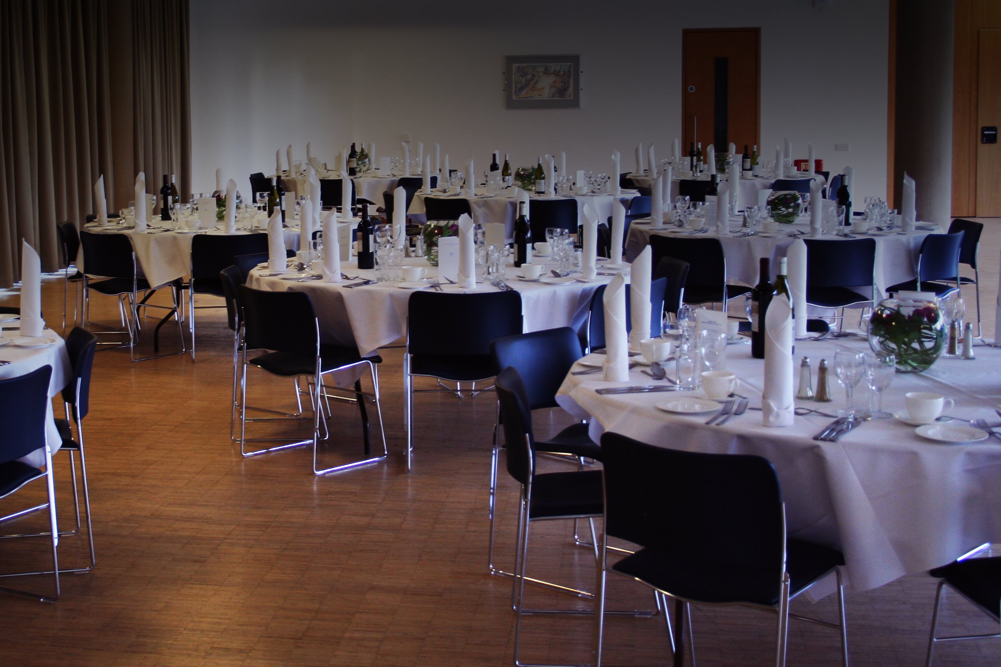 Maplethorpe Hall event space with elegant tables for formal gatherings and networking.