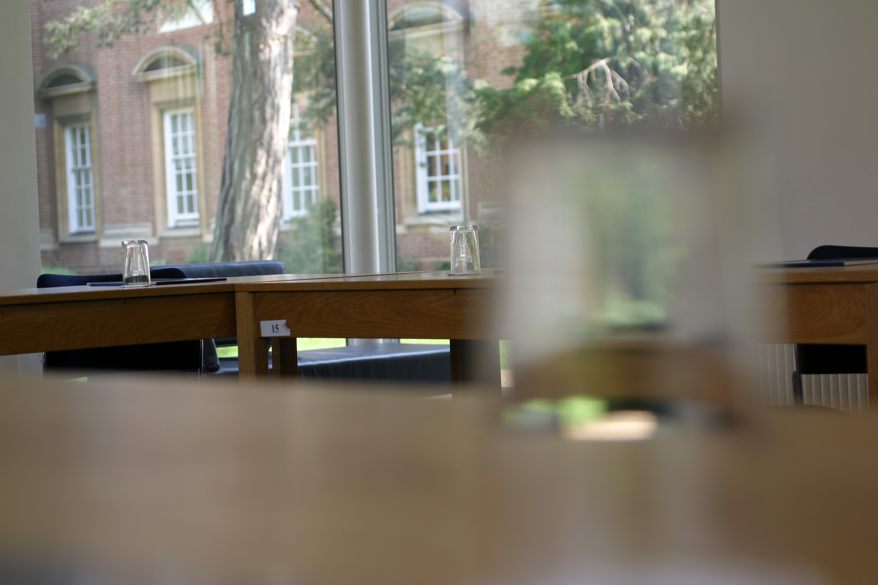 Maplethorpe Seminar Room at St Hugh's College, ideal for workshops with wooden tables.