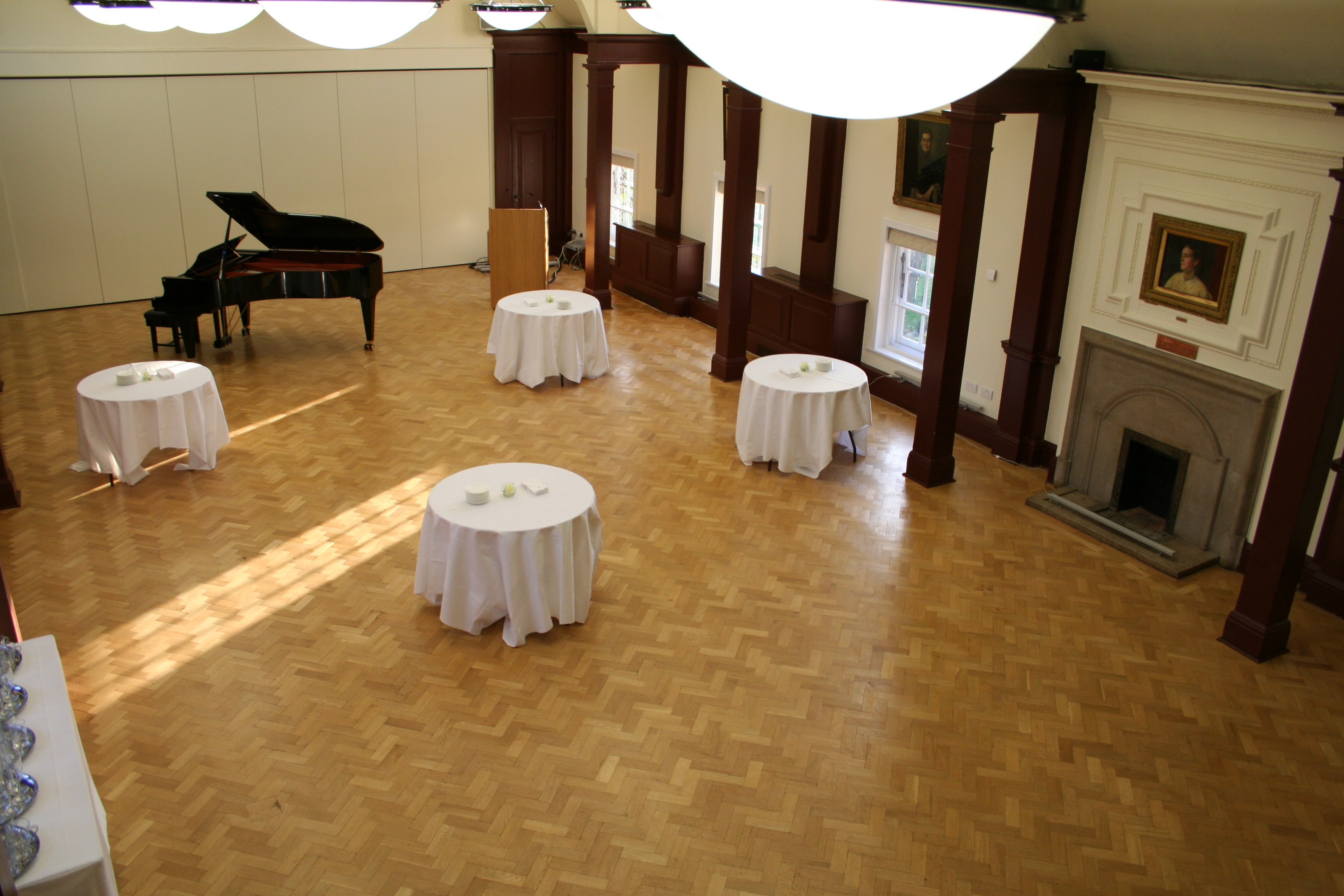 Mordan Hall at St Hugh's College: elegant event venue with polished floors and natural light.