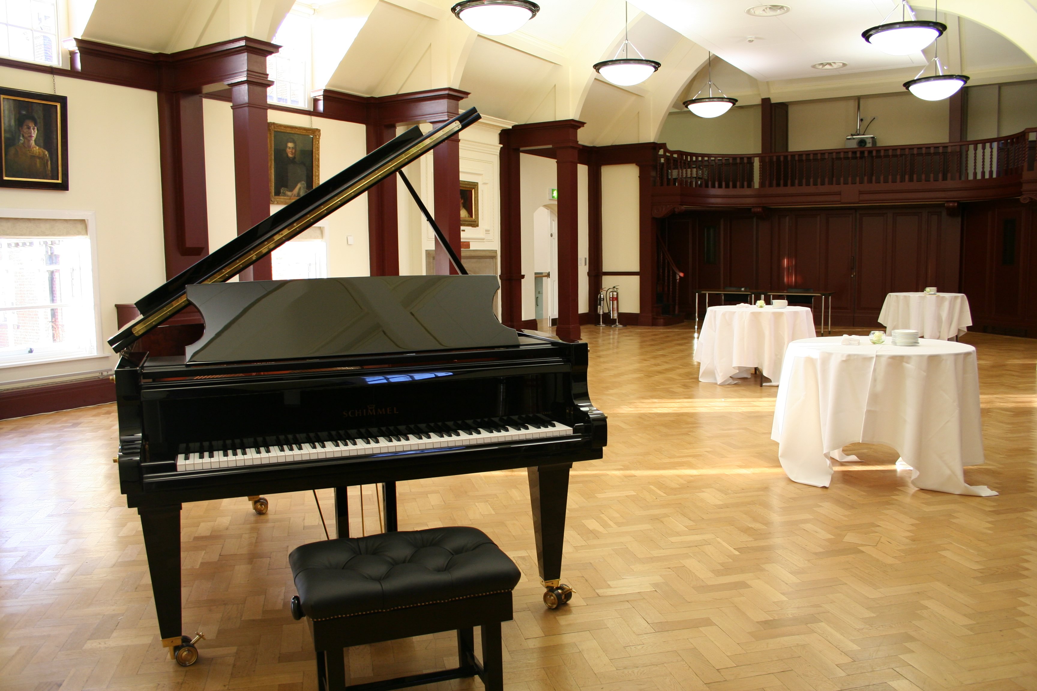 Mordan Hall at St Hugh's College with grand piano, ideal for corporate events and celebrations.