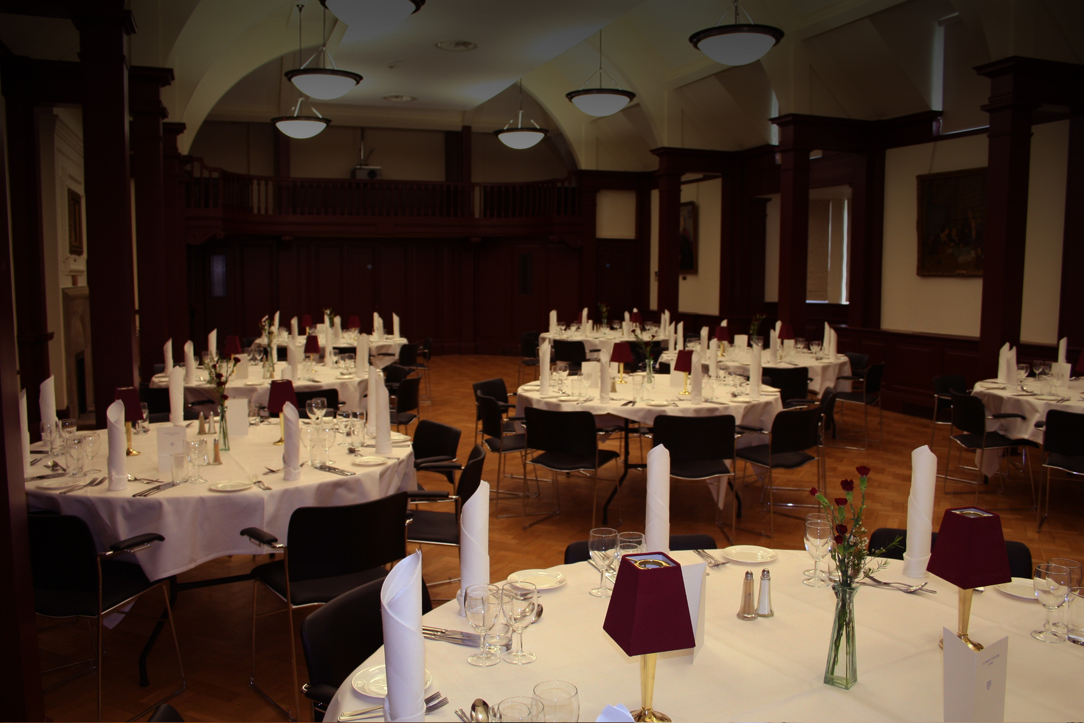 Mordan Hall event space with round tables, ideal for formal gatherings and banquets.