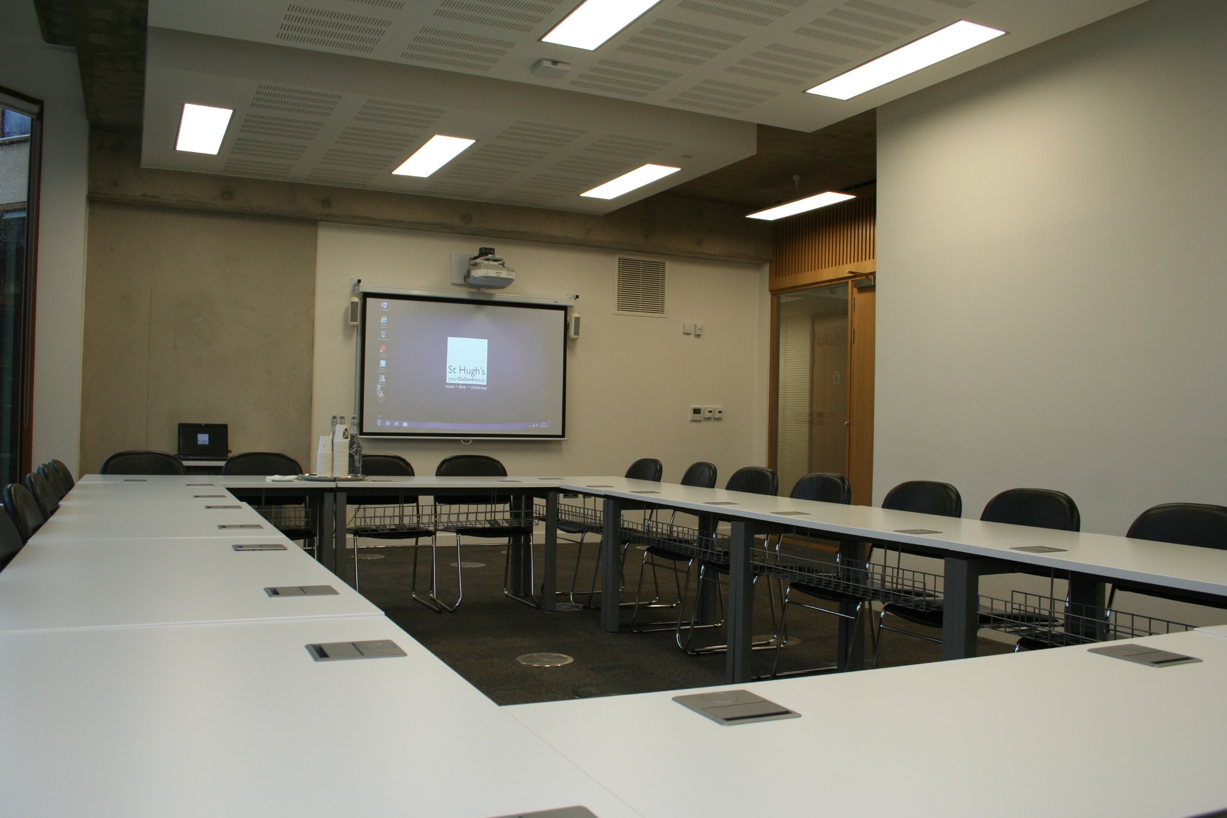 Modern Dickson Poon Seminar Room at St Hugh's College, ideal for meetings and presentations.