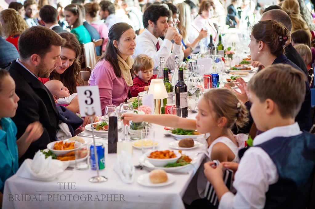 Lively banquet in St Hugh's College Dining Hall, perfect for weddings and formal events.