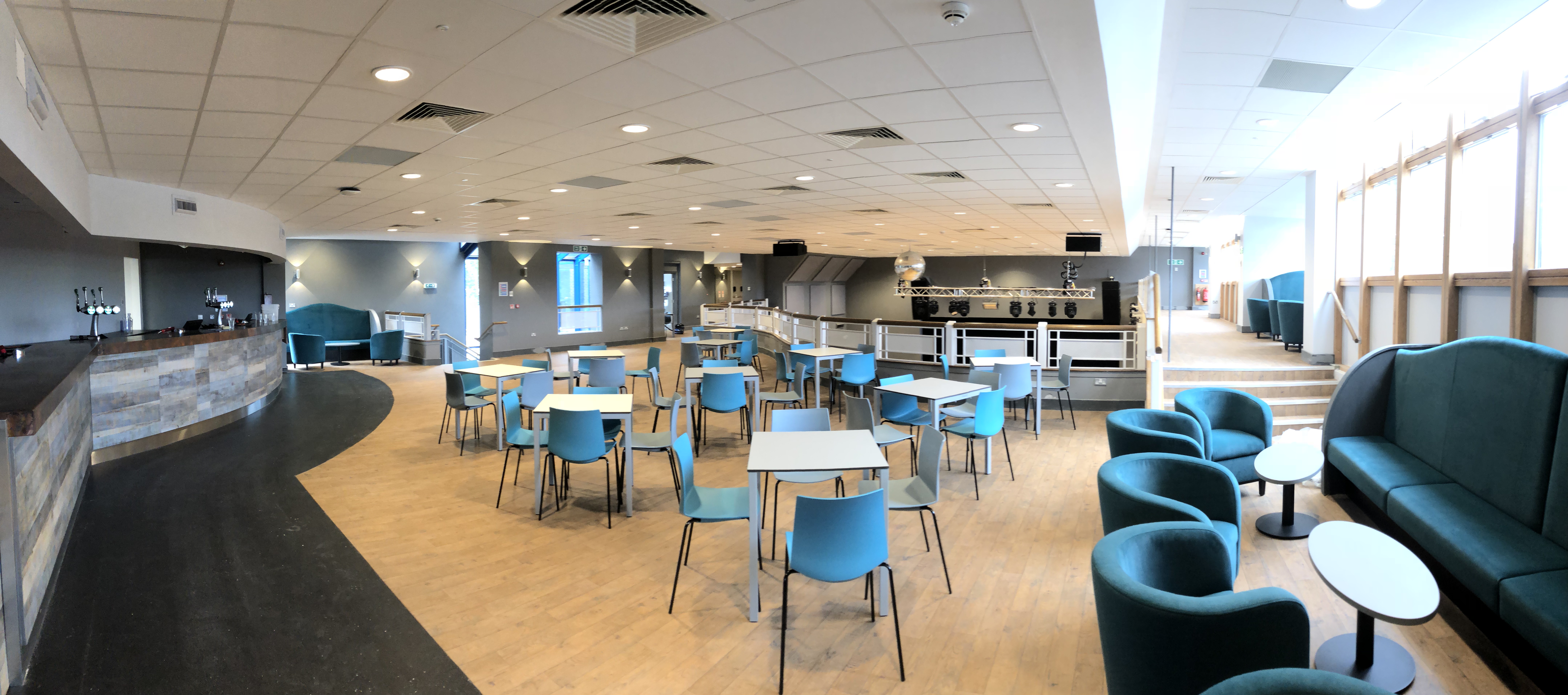 Versatile event space at Reading University with modern seating for networking and gatherings.