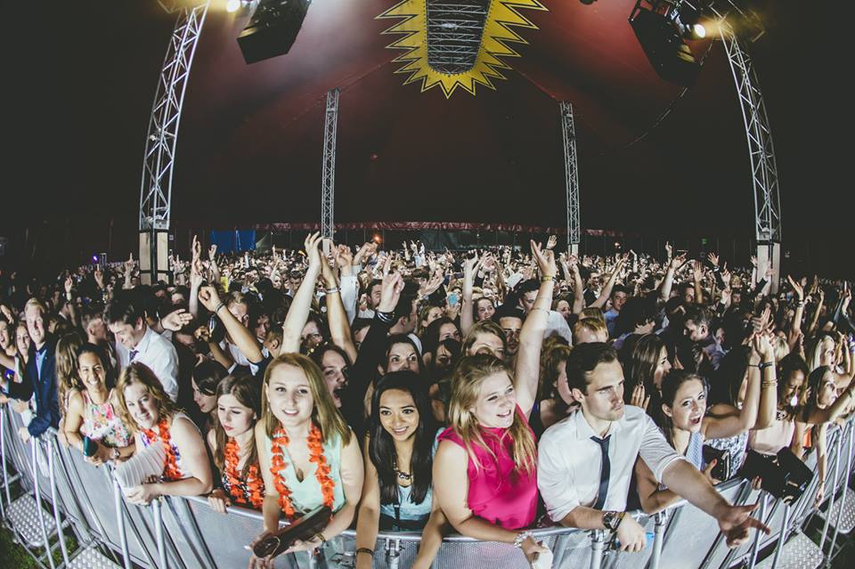 Vibrant crowd at Mojos, Reading University, showcasing lively event energy and engagement.