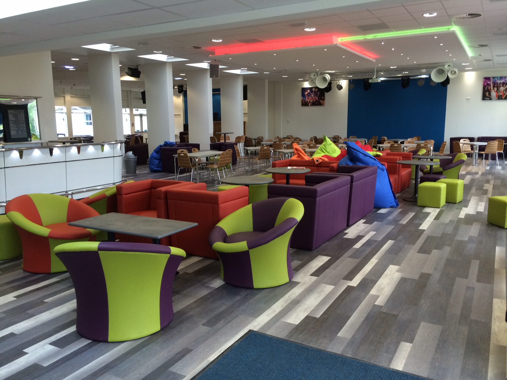 Vibrant event space at Reading University with colorful furniture for networking gatherings.