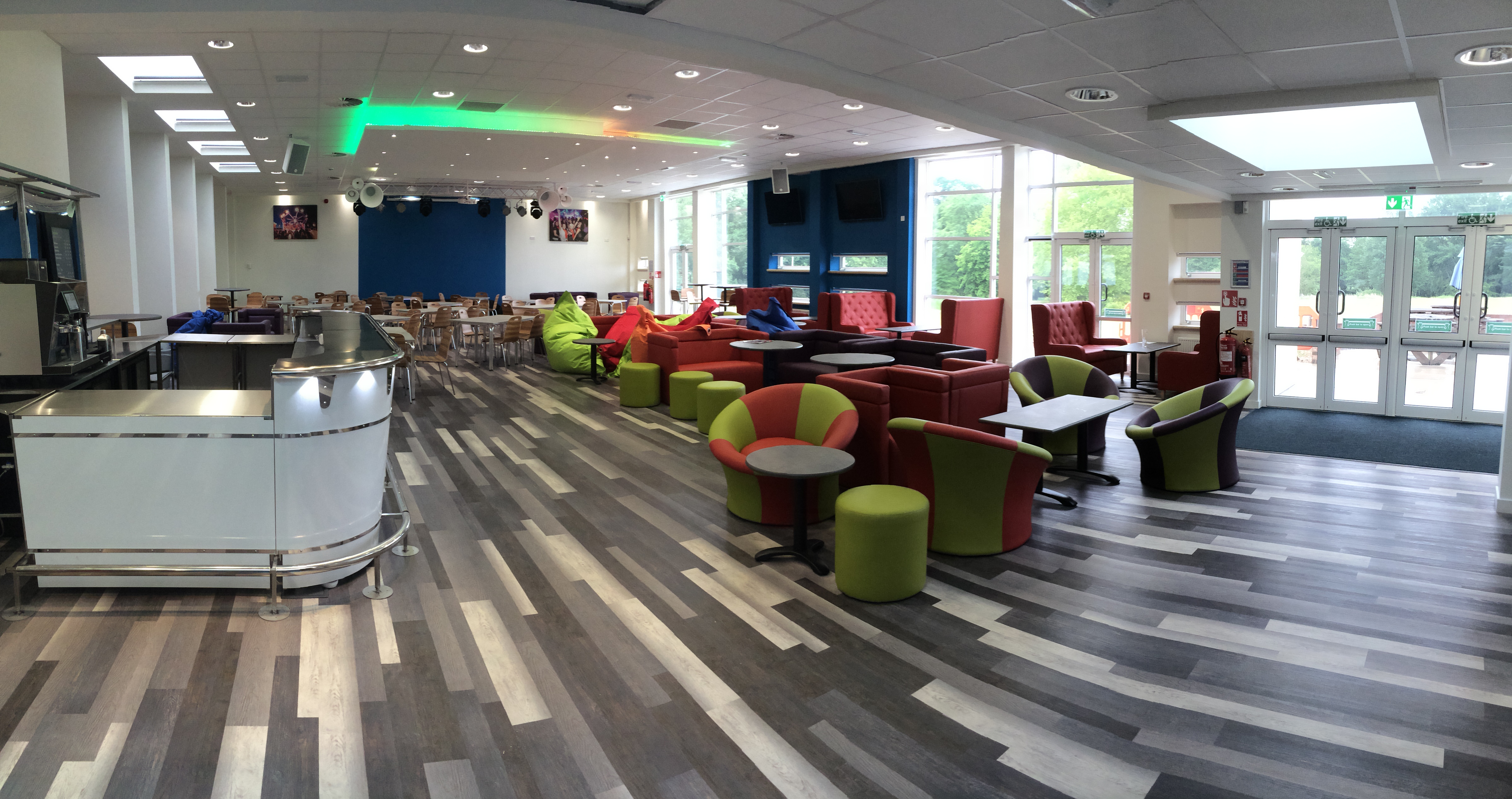 Modern event space at Reading University with vibrant seating for networking and workshops.