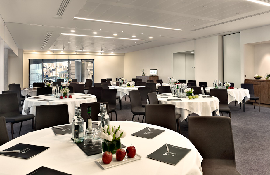 Meeting room at DoubleTree by Hilton London, bright with round tables for corporate events.