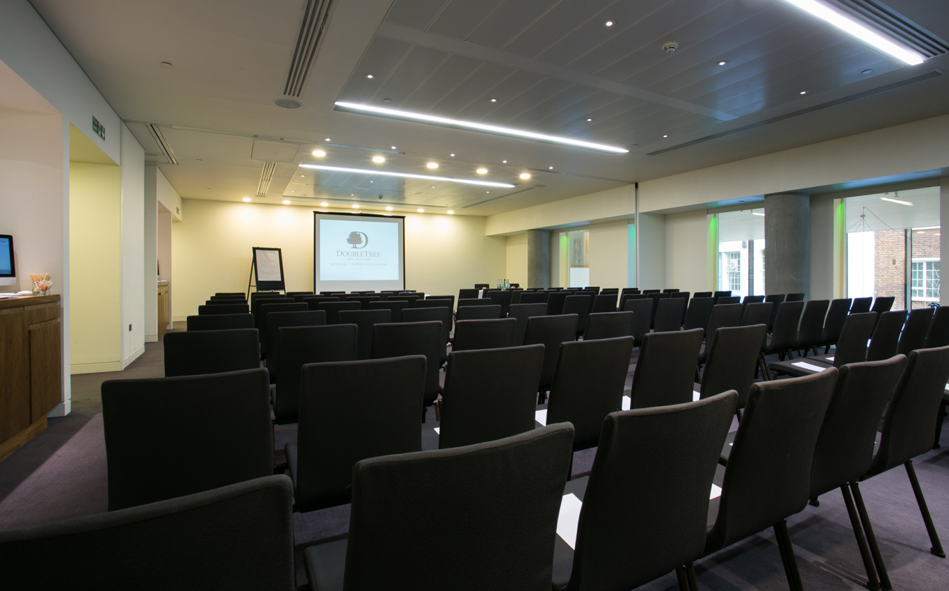 Modern meeting room with black chairs, ideal for workshops and seminars at DoubleTree London.