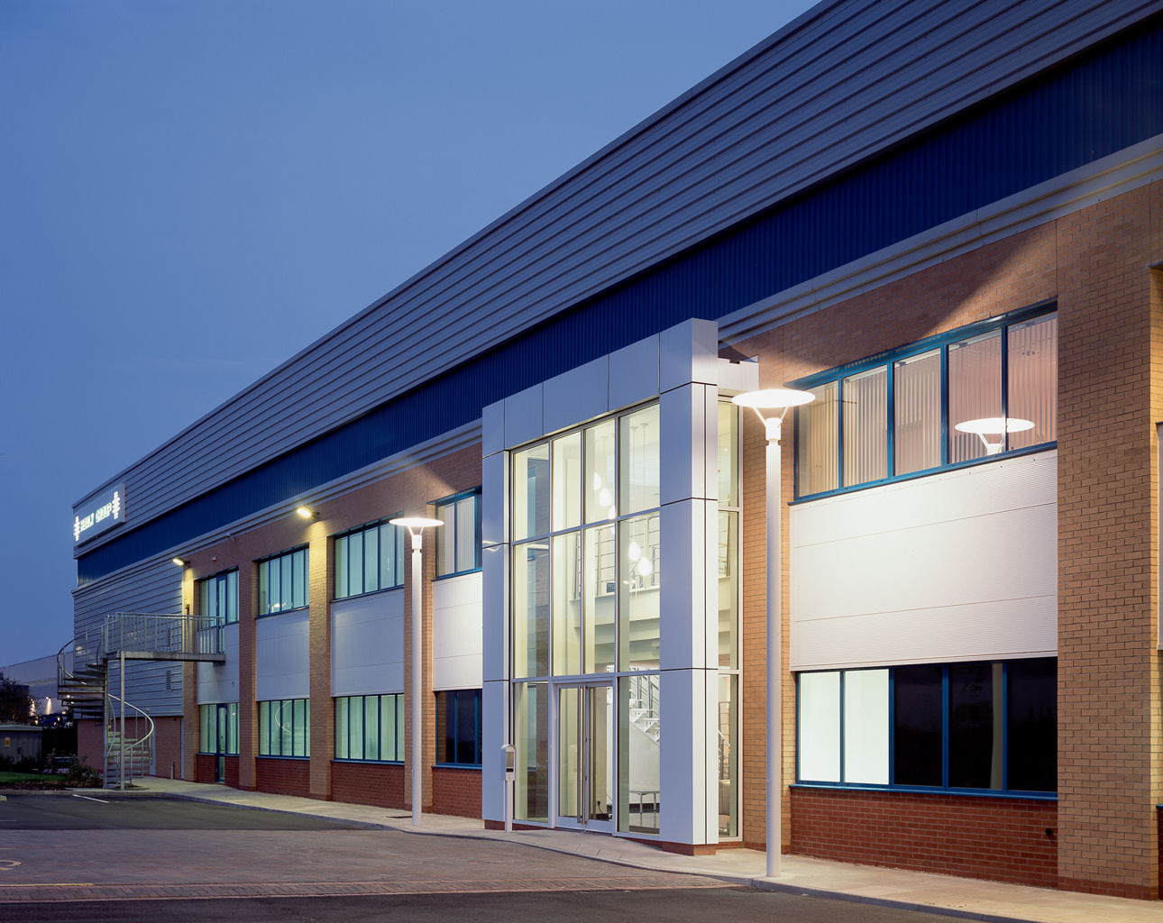 Modern kitchen venue with large windows, perfect for corporate events and social gatherings.