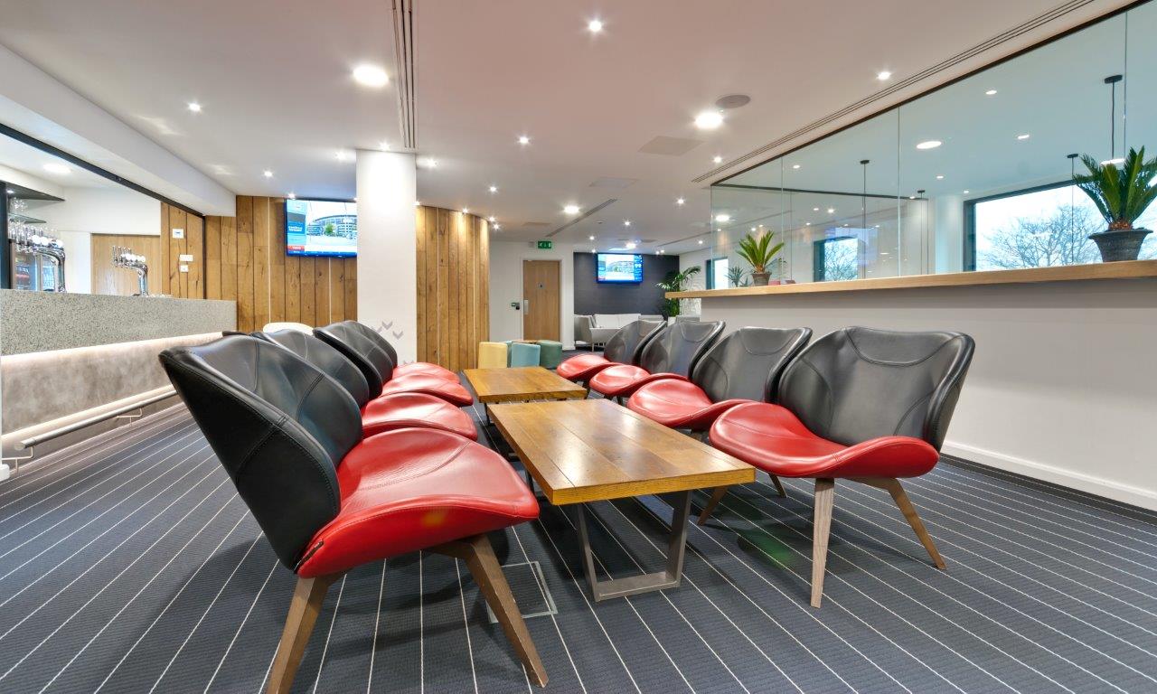 Modern lounge at Hotel Football, featuring stylish seating for networking and casual meetings.
