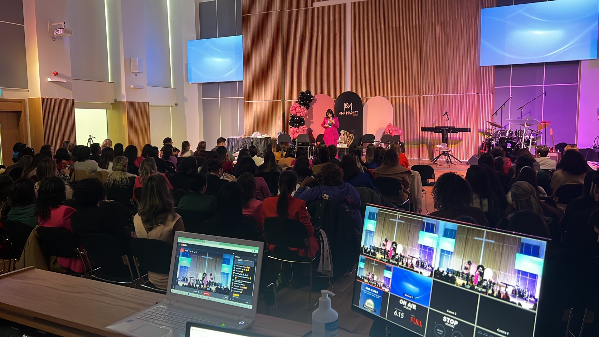 Westbourne Park Baptist Church auditorium with speaker at a well-attended event.