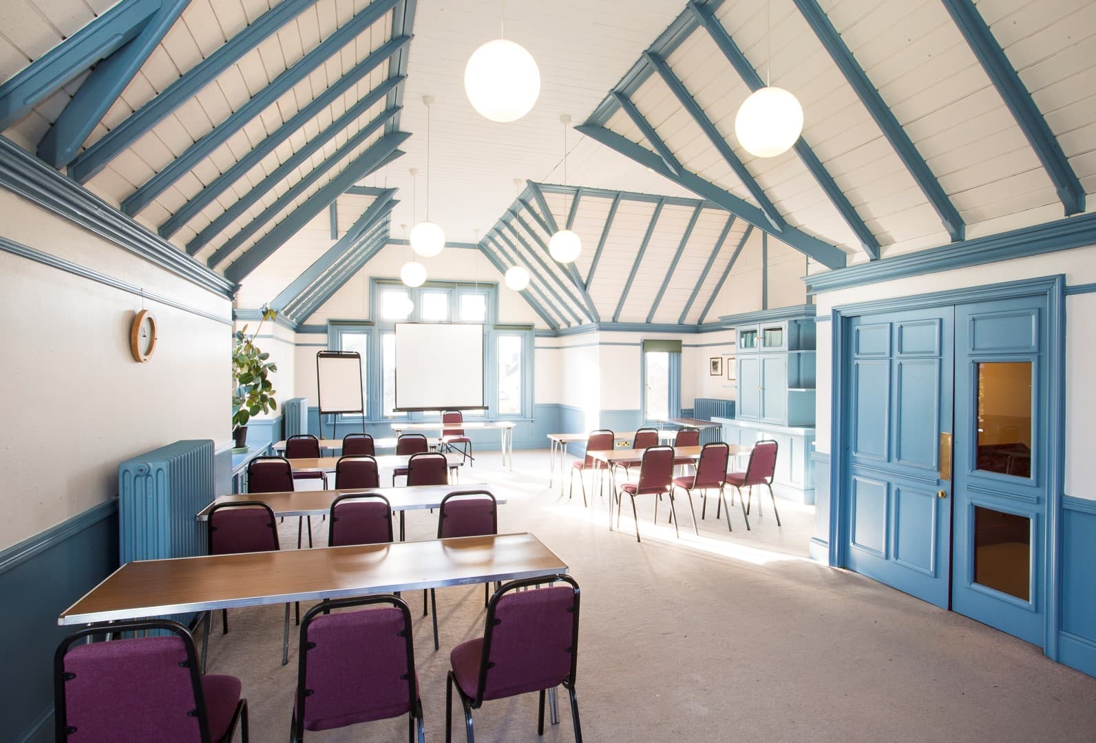 The Stephens Room: Vaulted ceiling meeting space for corporate workshops and training sessions.