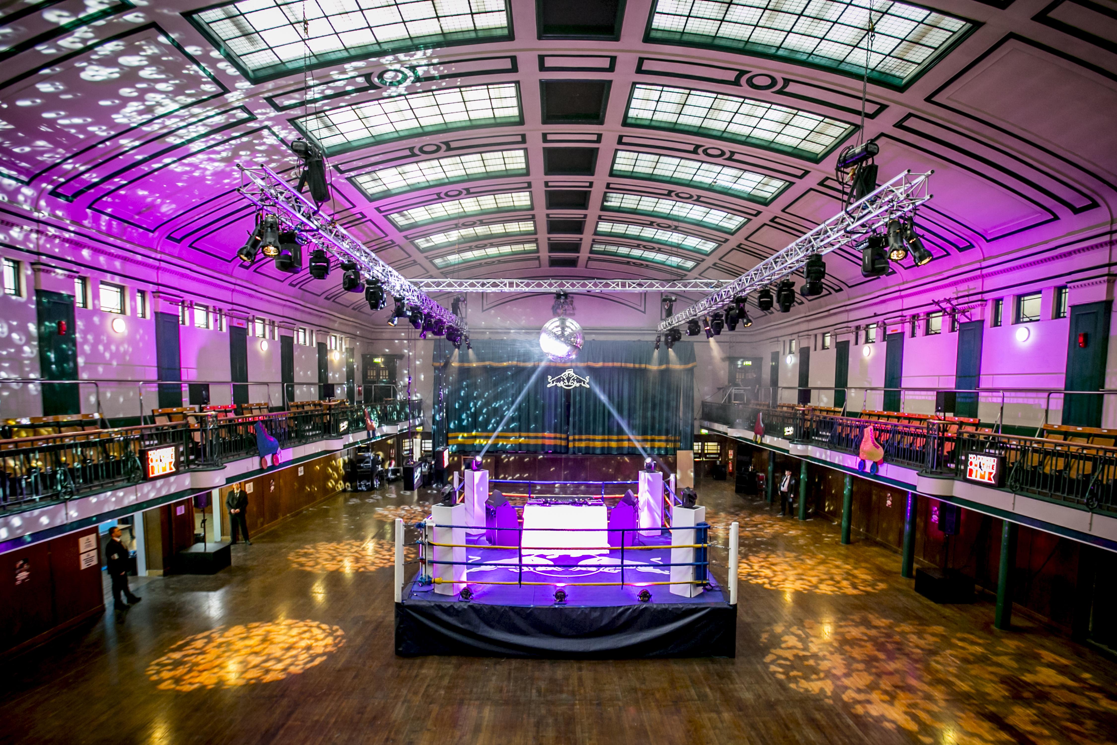 York Hall event space with elevated stage, ideal for corporate and social gatherings.