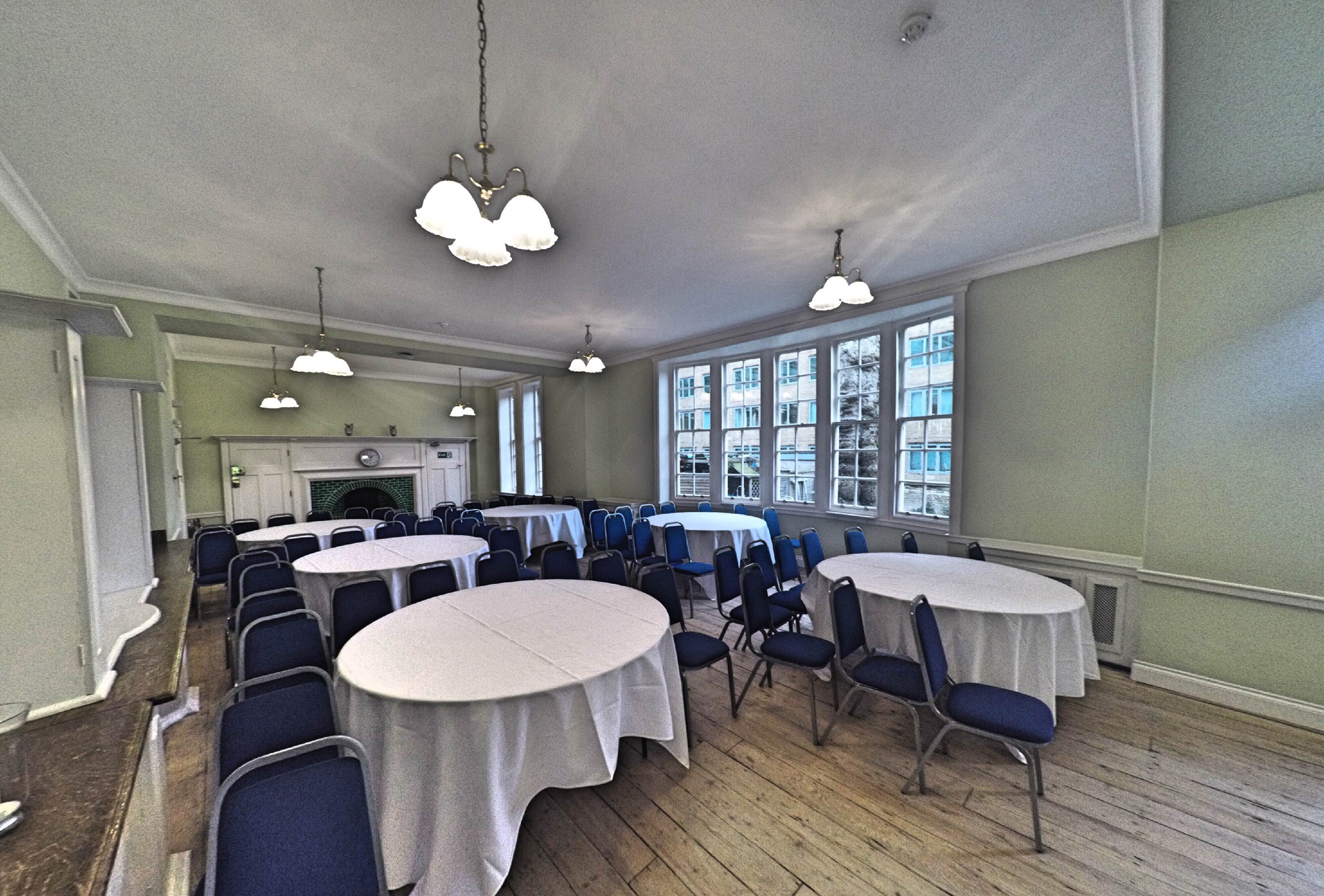 Lethaby Room at Mary Ward House, bright meeting space with round tables for events.