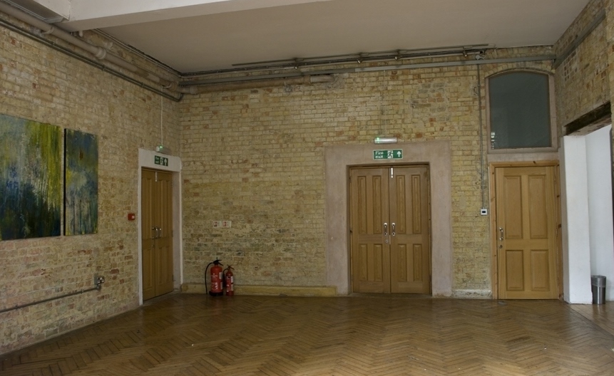 Arnold Room at Mary Ward House: versatile event space with exposed brick walls for gatherings.