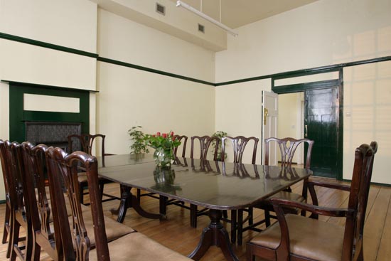 Boardroom in Mary Ward House with polished table, ideal for meetings and events.