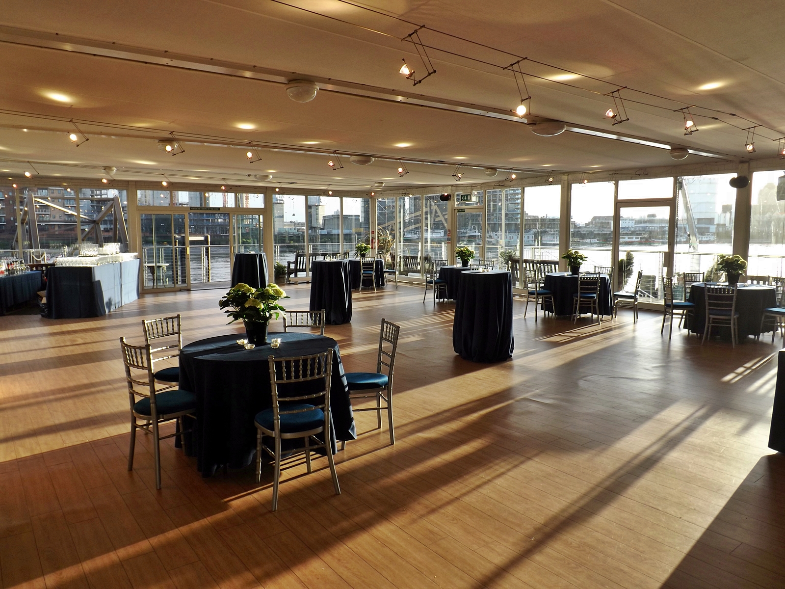 Elegant event space with navy linens, ideal for corporate meetings and receptions.