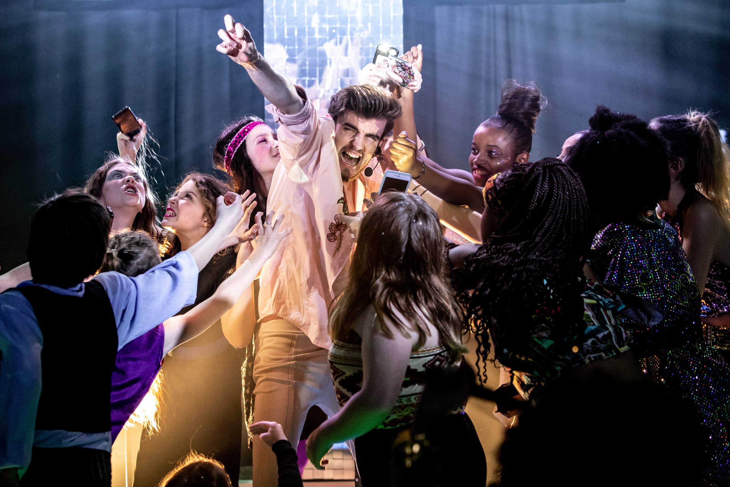 Dynamic performance at Young Actors Theatre, engaging audience in vibrant atmosphere.